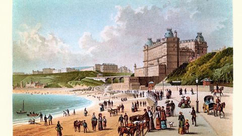 An old postcard showing the seaside at Scarborough.