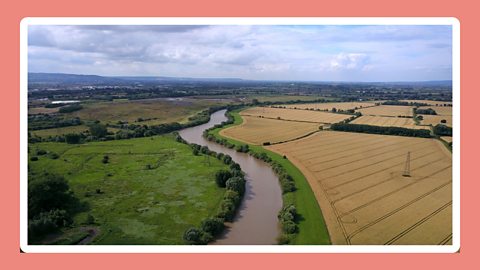 Fields with crops by the River Severn.