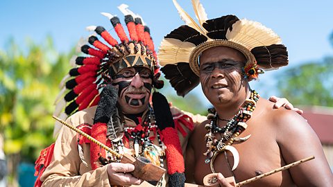 The Tupi Guarani people live in the Amazon rainforest in Brazil. There are many different Amazon groups in addition to the Tupi Guarani. Much of the rainforest is challenged by the presence of miners and loggers. The government of Brazil have taken steps to remove the rights of rainforest people. The current president, Jair Bolsonaro wants to use the land for farming and mining. 