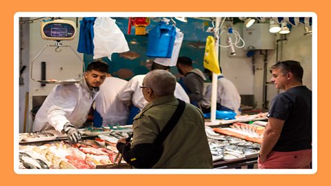 People at a fish market in Birmingham.