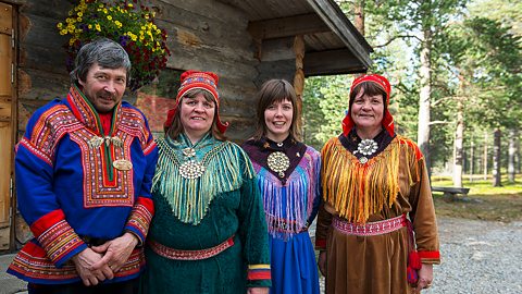 A Sámi family in traditional clothing in Inari, northern Finland