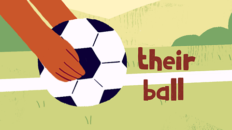 A hand holds a ball. Text reads 'their ball'