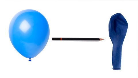 An image of an inflated balloon and an uninflated balloon with a pencil between them. The sharp end of the pencil is pointed at the uninflated balloon.