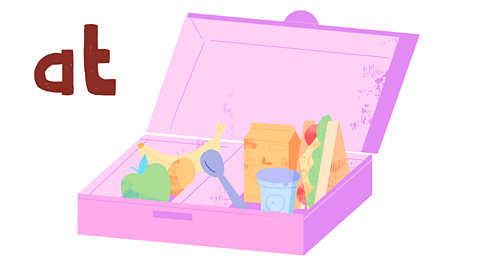 An open lunch box with word 'at' next to it.