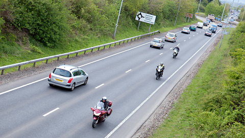 The A75 road in Dumfries busy with cars and motorcycles