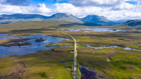 Aerial view of Rannoch Moor and the A82 running down the middle