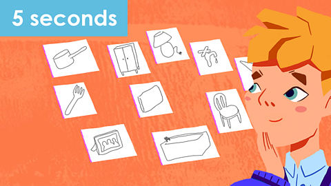 A boy looks at home items drawn on individual pieces of paper, for five seconds