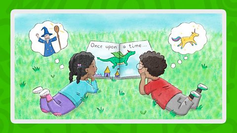 Two children read a picture book on the grass