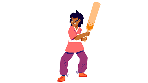 A boy playing cricket.