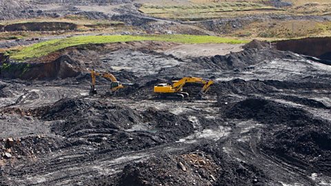 Two diggers digging for coal in Glentaggart mine 