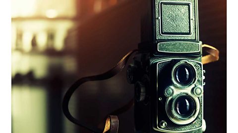 Closeup of an old camera with two lenses