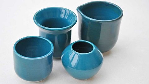 Glossy blue ceramic pots of different shapes