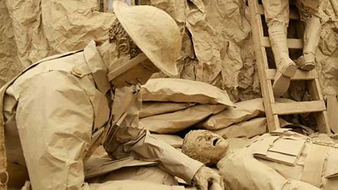 A life-sized depiction of World War 1 soldiers made of brown paper and cardboard