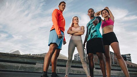 Two young men and two young women in sports clothes