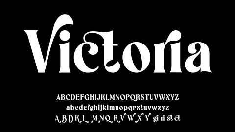 Victoria. White writing against black background. The lettering is very rounded and joined together in unusual ways