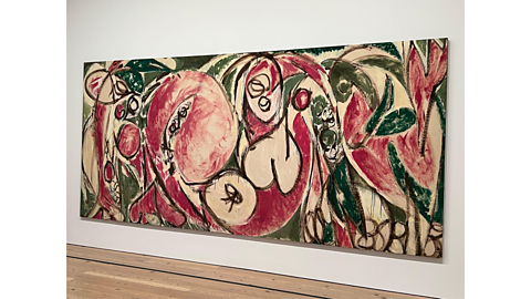 A colourful painting in green, cream and pink by Lee Krasner. The canvas is a rectangular shape and the painting is quite big. 