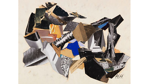 A collage made from bits of paper and other flat materials. Some pieces are black, some brown and there are a few white, blue and yellow pieces too.