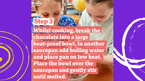 Two young girls breaking a chocolate egg into a bowl.