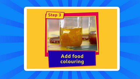 A photograph of a jam jar with yellow water and label step 3 and add food colouring.