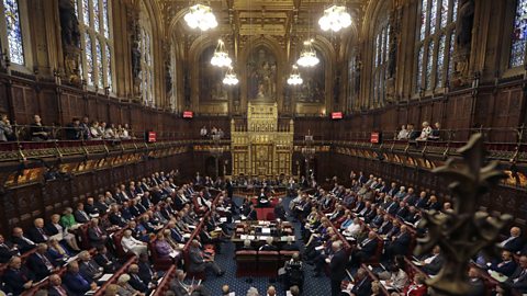 Inside the House of Lords with peers present, debating.