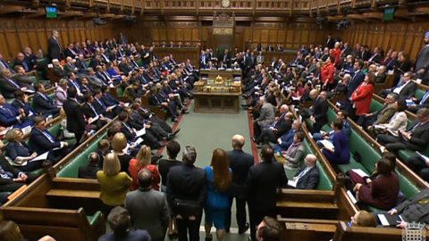 The House of Commons with MPs present, debating.