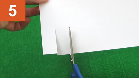 Strip fringe - 5. Scissors at edge of paper, parallel to previous cut