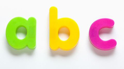 Fridge magnets of the letters a, b and c.