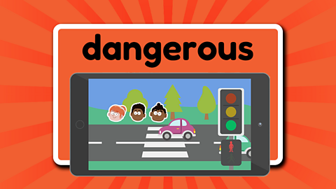 The word dangerous above a tablet device showing a busy road and a pedestrian crossing with the traffic lights green for the cars to go and a red man showing warning not to cross the road. There are 3 children waiting at the crossing.