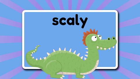 The word scaly above a cute scaly dragon.