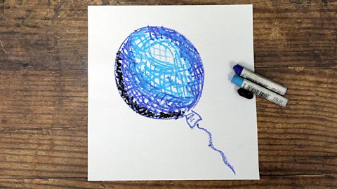 A picture of a balloon done with oil pastels in a cross-hatch method