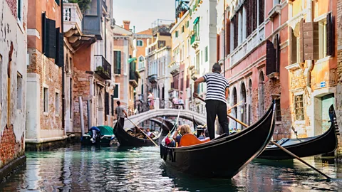 Gondola in canal in Venice, Italy