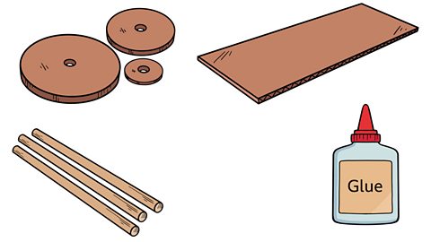 One large wheel,  one medium wheel, one small wheel, one piece of corrugated card, three short dowels and a piece of corrugated card.