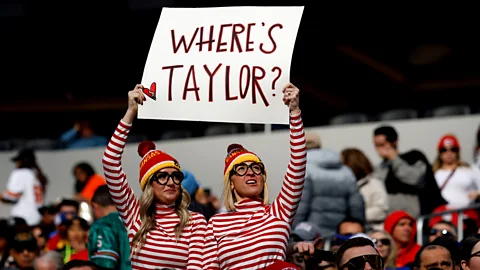 Taylor Swift fans holding sign