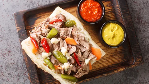 Chicago Italian beef sandwich on a wooden tray