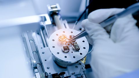 A mechanical engineer working on a piece of micro-mechanical technology.