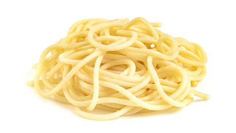 Spaghetti noodles on a white background