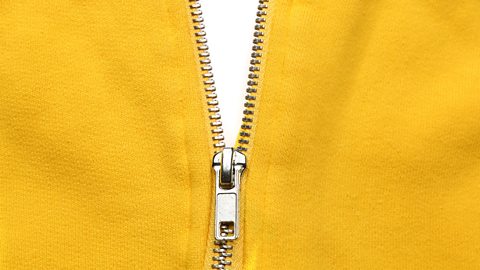 A close up of a yellow jacket with a zip