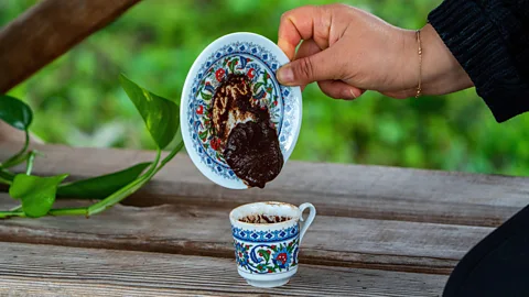 Coffee fortune telling in a classic patterned Turkish cup