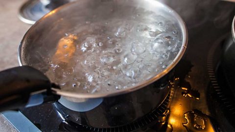 A pan on a electric hob boiling