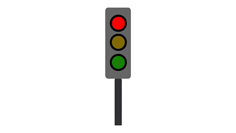 A traffic light with the red light lit up at the top. The amber and green lights are off.