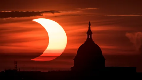 Partial eclipse seen behind Capitol Hill (Credit: Getty Images)