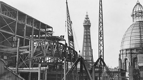 An old image of a construction site with Blackpool Tower in the background.