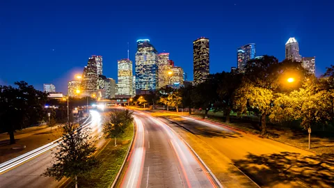 Texas highway cityscape at night (Credit: Getty Images)
