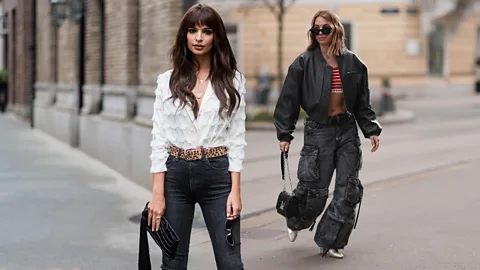 Emily Ratajkowski in skinny jeans and model in baggy cargo pants