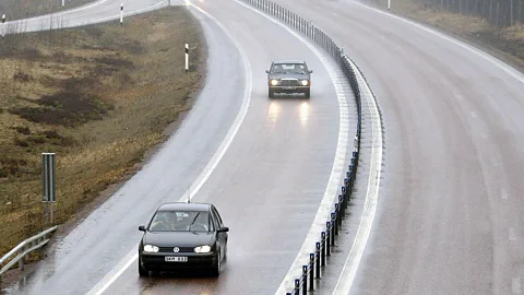 Cars driving on a dual carriageway road with a wire barrier (Credit: Getty Images)