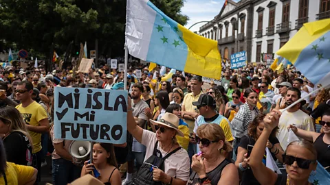People demonstrating against tourism policies on Tenerife in April 2024 (Credit: Getty Images)