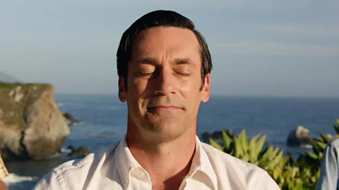 Don Draper (Jon Hamm) of Mad Men meditating with sea view in background