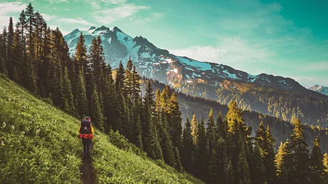 Person hiking on mountain slope