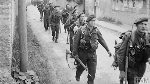 Archive photo of soldiers marching on D-Day (Credit: IWM (B 5067))