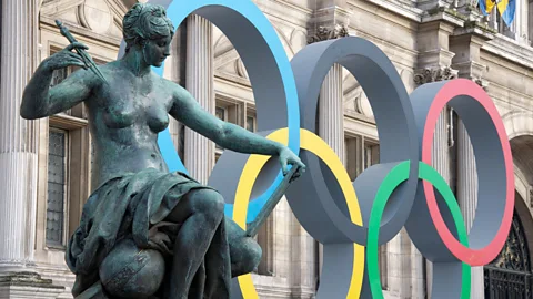 Olympic rings and statue in France (Credit: Alamy)